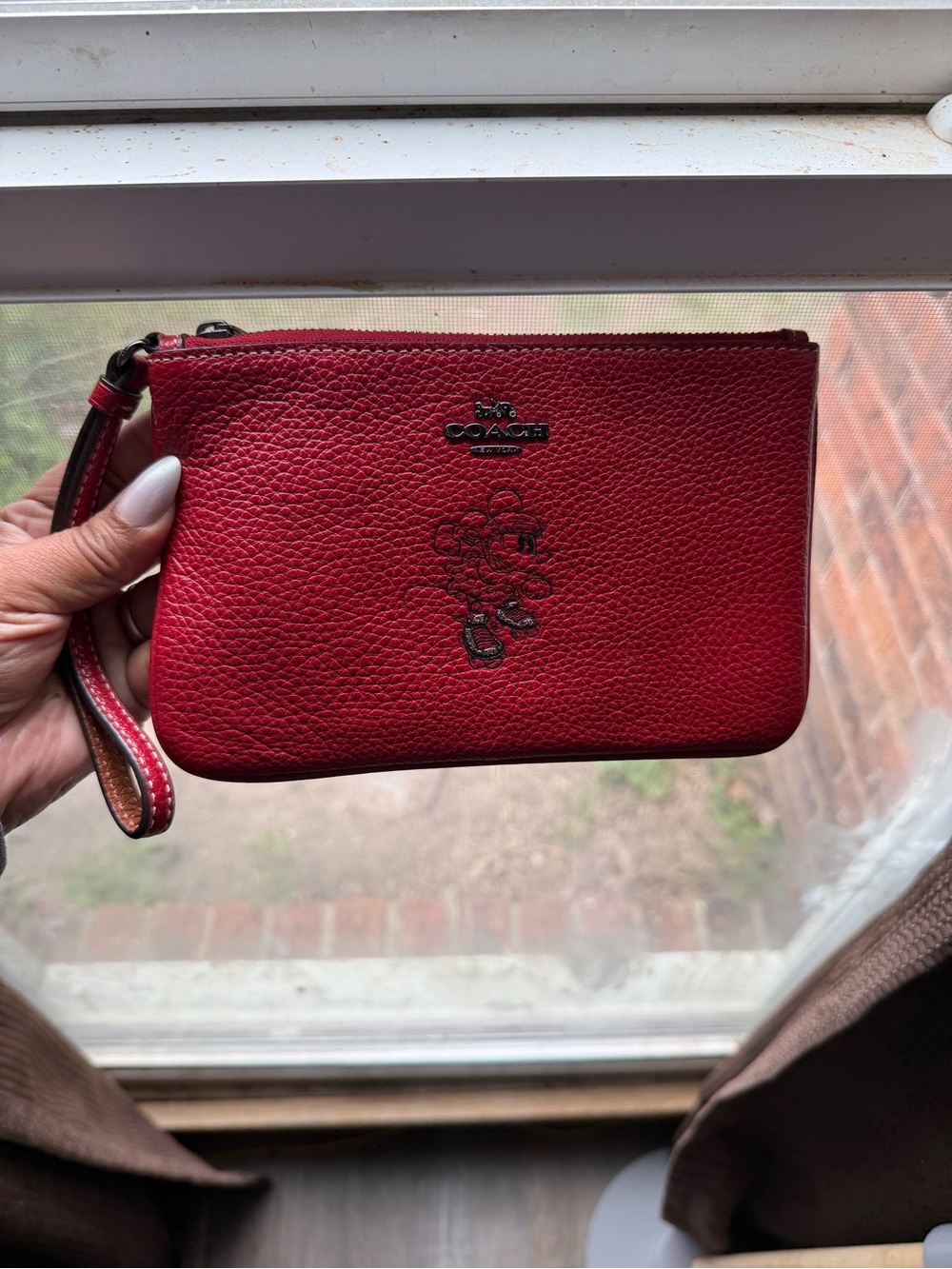 Coach Red Pebbled Leather Wristlet with Embossed Floral Charm